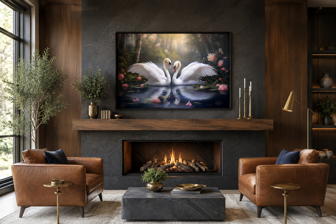 Two white swans in a lake romantic framed canvas wall art hanging above a modern fireplace.