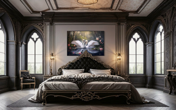 Framed canvas wall art of two white swans on a lake, hung above a dark gothic-style bed.