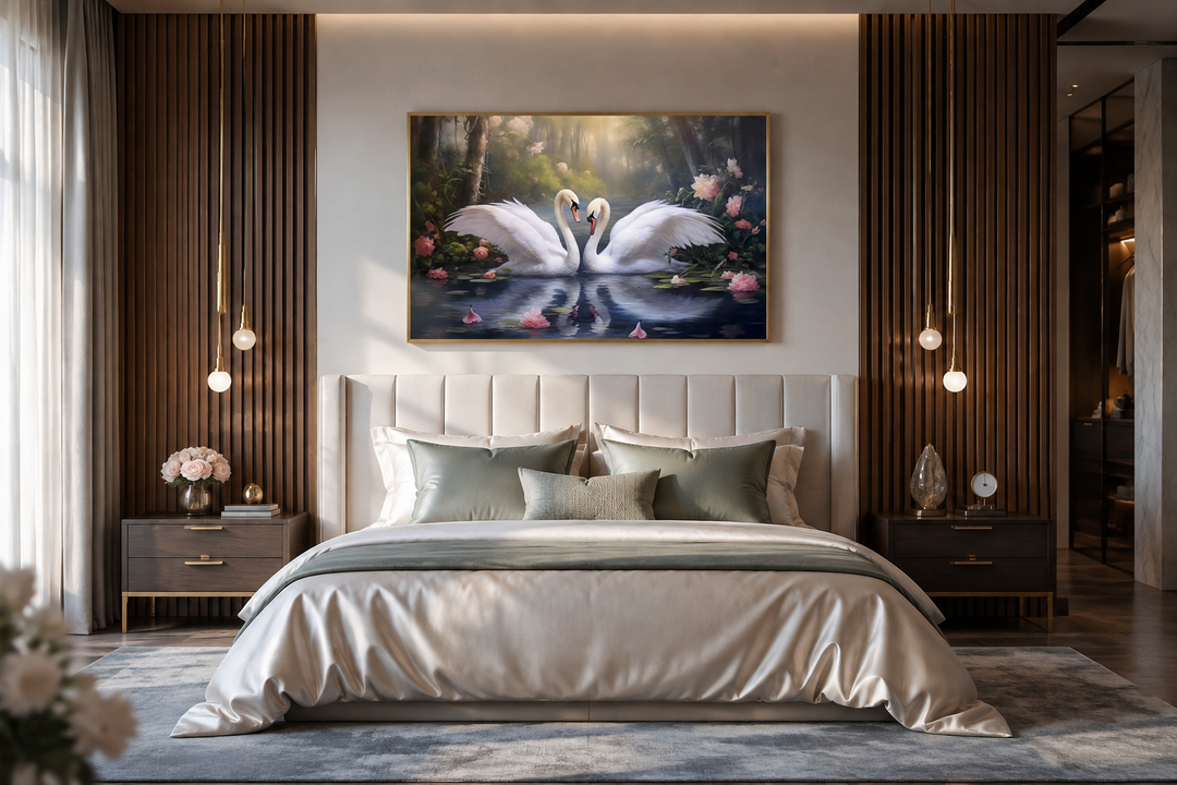 Romantic framed canvas wall art of two white swans on a lake, hanging above a bed in a bedroom.