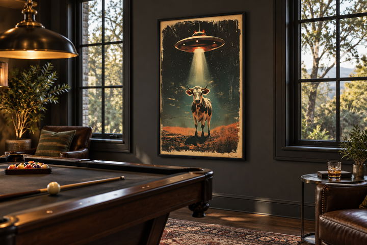 Retro UFO cow abduction framed canvas wall art hanging in a dark, moody game room with a pool table.