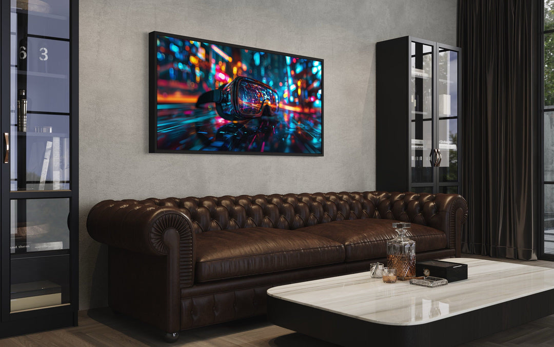 VR Goggles Wall Art canvas print with neon lights hanging above a brown leather chesterfield sofa.