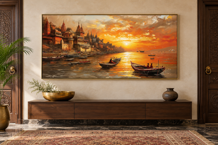Varanasi wall art of the Ganges River at sunset, framed and hanging above a wooden console table.