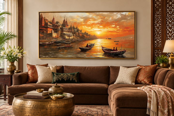Varanasi wall art featuring a sunset over the Ganges River above a brown sectional sofa.