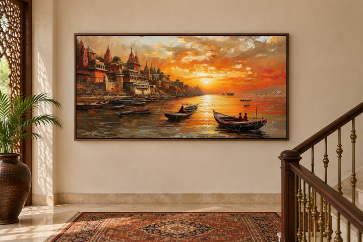 Varanasi wall art of a Ganges River sunset in a walnut frame on a neutral wall near a staircase.