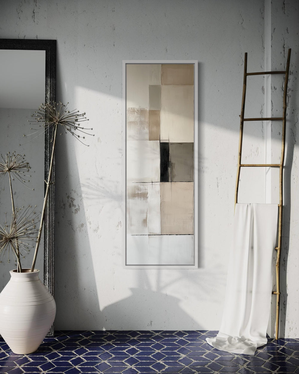 Vertical abstract geometric wall art with neutral beige, black, and white panels in a white frame.