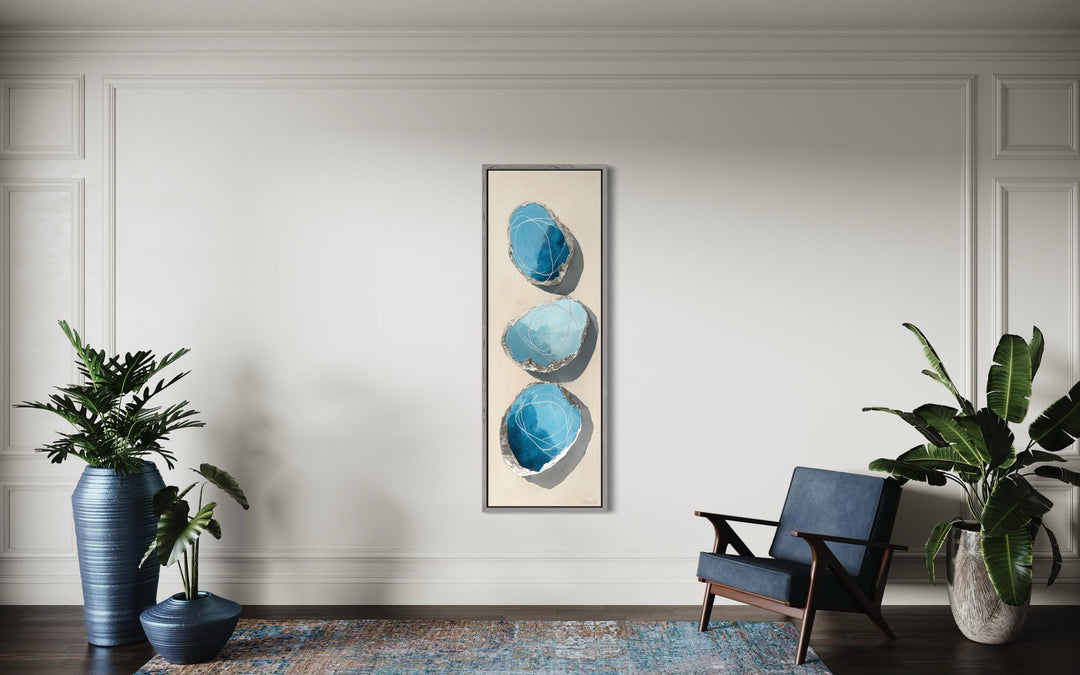 Vertical canvas print featuring three stacked abstract blue stones with silver outlines.