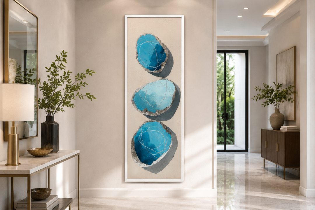 Vertical canvas print with three stacked abstract blue and silver stones on a neutral background.