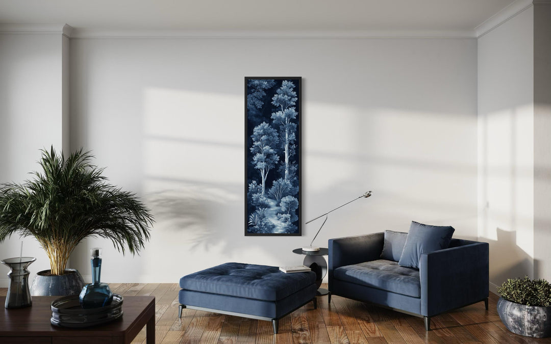 Vertical narrow wall art featuring a blue and navy night forest in a modern living room.