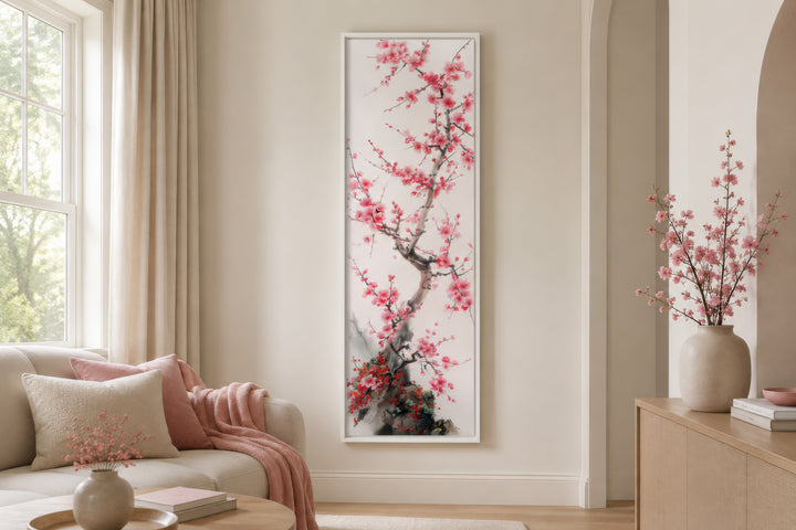 Vertical narrow wall art featuring a delicate cherry blossom tree in a white frame.