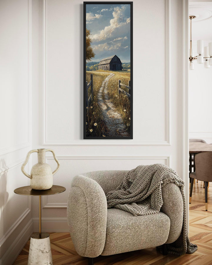 Vertical narrow canvas wall art of a rustic barn in a golden wheat field under a cloudy sky.