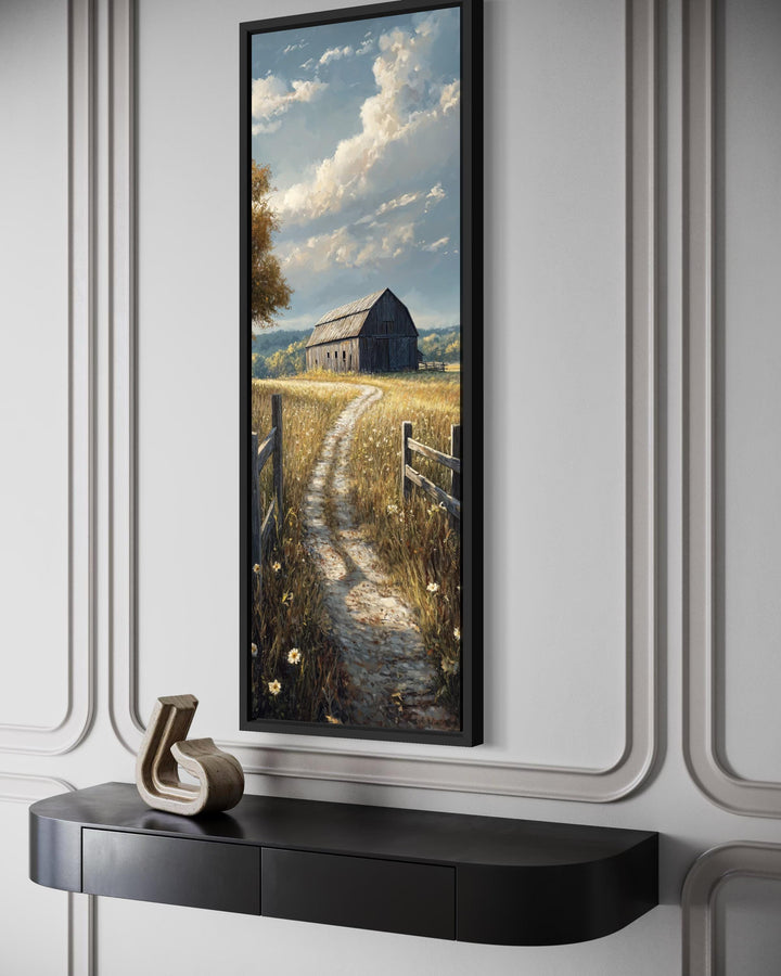 Vertical narrow canvas wall art featuring a rustic barn and a path through a golden wheat field.