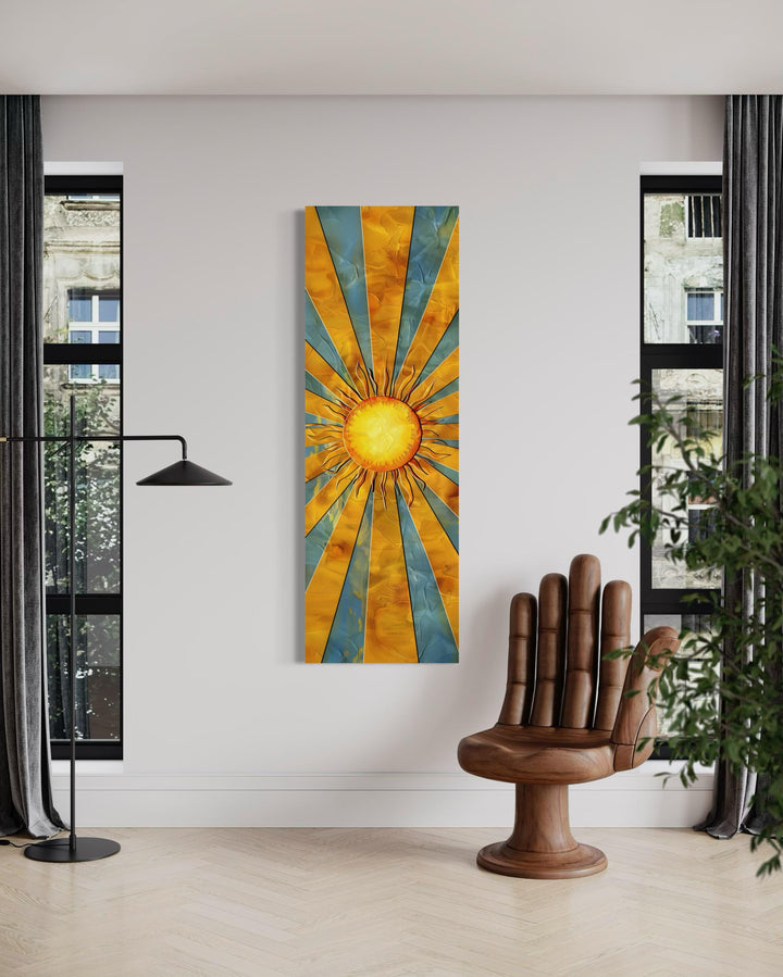 Vertical narrow framed canvas wall art featuring a yellow sun with rays against a blue sky.