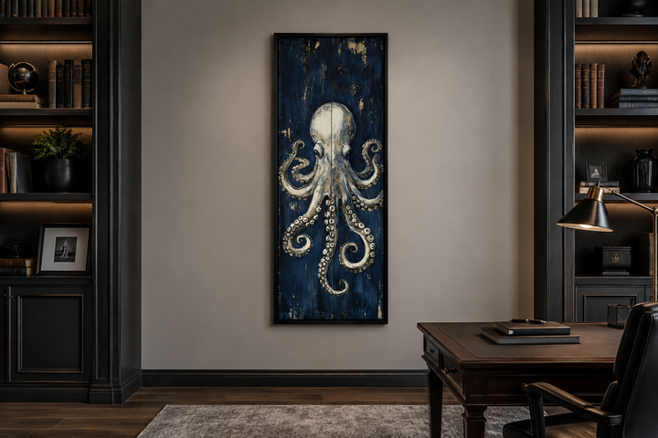 Vertical octopus canvas wall art with metallic tentacles on a navy background in a home office.