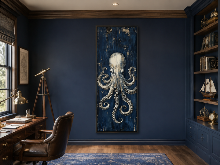 Vertical octopus canvas wall art with metallic tones on a navy background in a dark blue office.