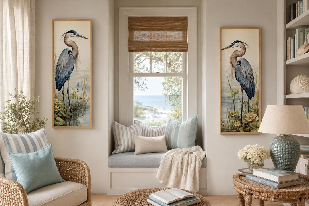 Set of two vertical canvas wall art prints featuring Great Blue Herons in a coastal living room.