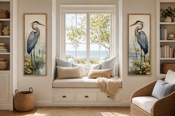 Vertical slim Great Blue Heron painting set of 2 canvas wall art hung on either side of a window.