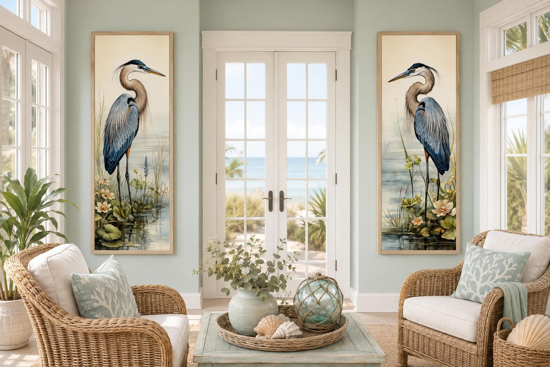 Vertical slim Great Blue Heron painting set of 2 canvas wall art in a coastal living room.