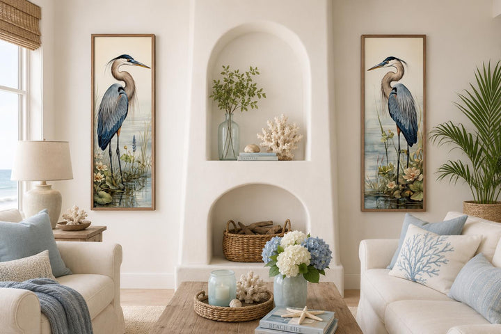 Set of two vertical canvas wall art panels featuring Great Blue Herons in a coastal living room.