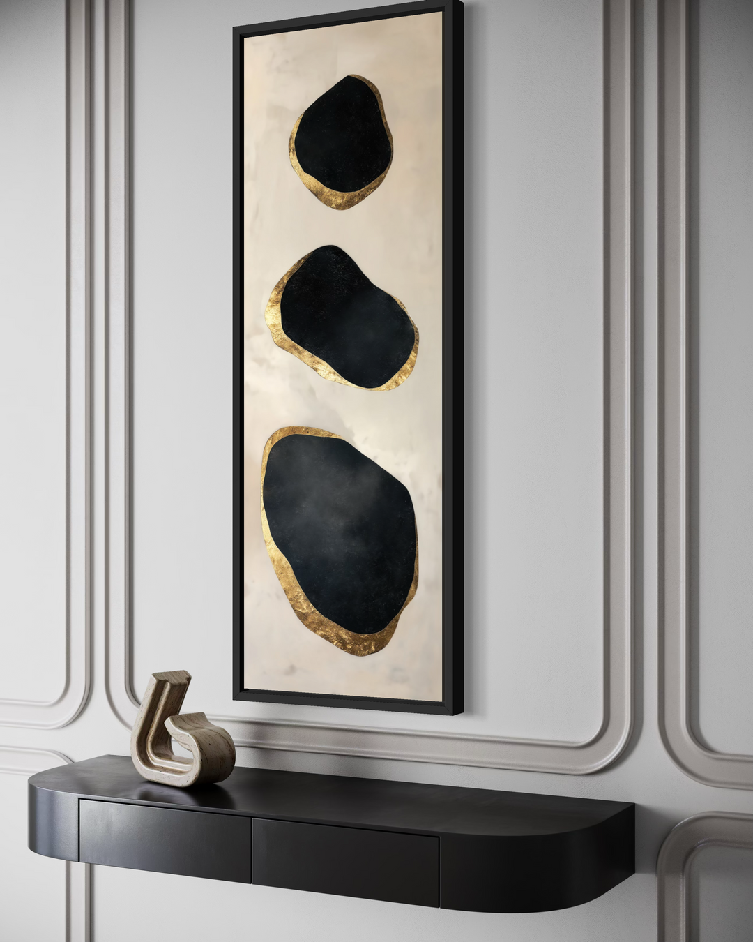 Vertical tall narrow wall art with three black abstract rock shapes and gold leaf edges.