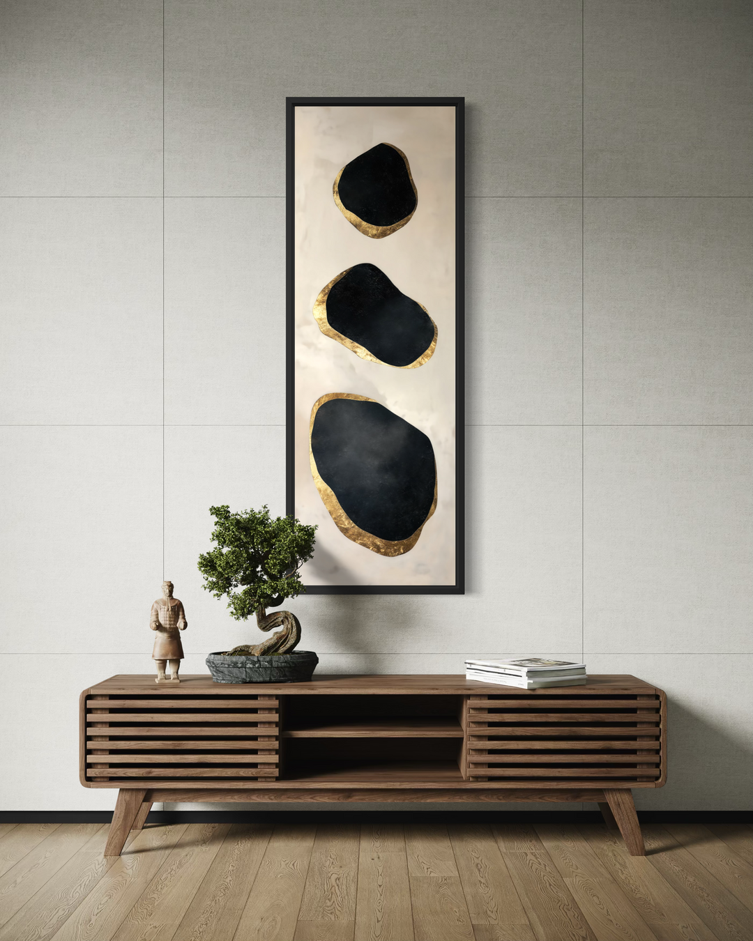 Vertical tall narrow wall art with black and gold abstract rock shapes above a wooden console.