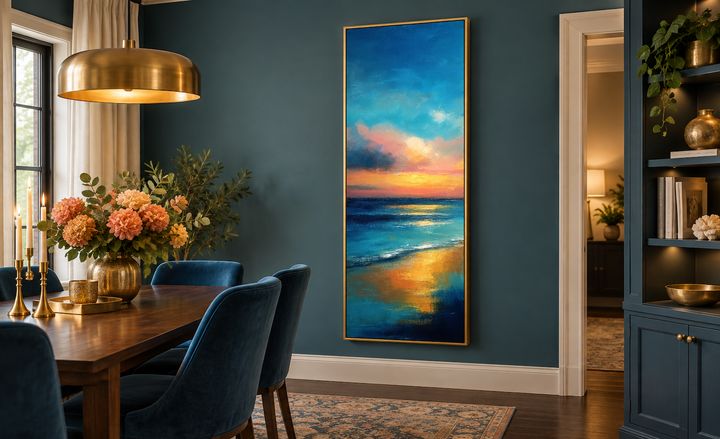 Vertical narrow abstract ocean sunset canvas wall art in a gold frame on a dark teal dining room wall