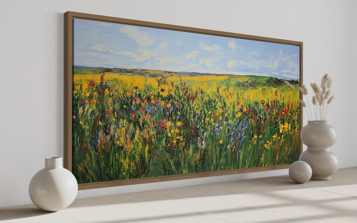 Vibrant impressionist wildflower meadow framed canvas wall art in a modern room setting.