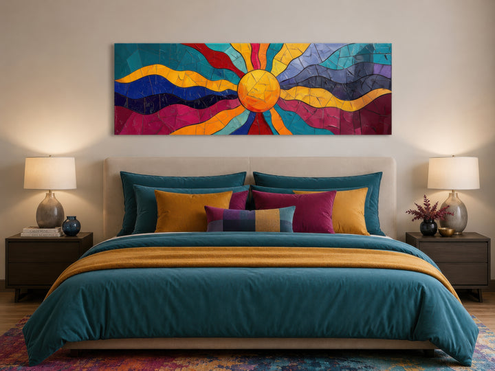 Vibrant multicolored sun long horizontal canvas wall art hanging above a bed in a modern bedroom.