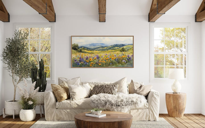Panoramic watercolor canvas art of yellow and purple wildflowers in a field with distant mountains.
