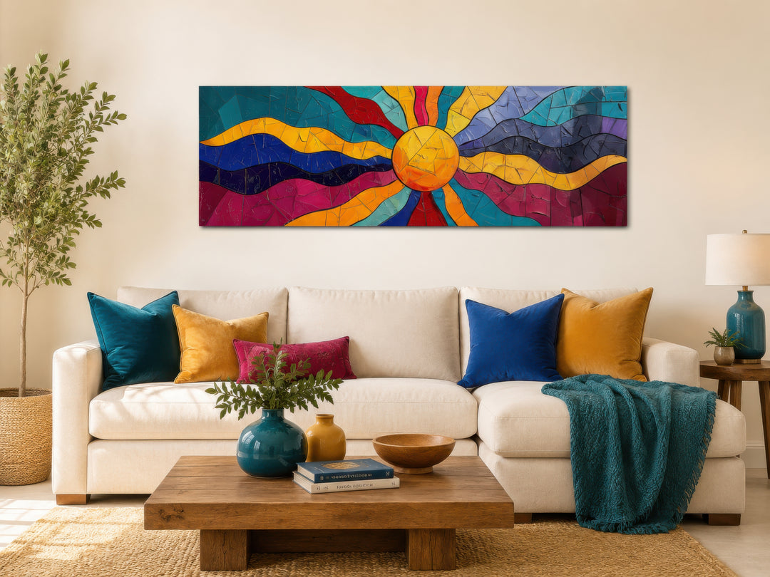Vibrant multicolored sun long horizontal canvas wall art above a white sofa in a living room.
