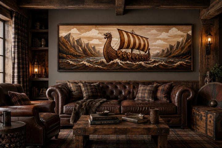 Viking longship canvas print on a dark wall above a leather sofa in a rustic, wood-paneled room.