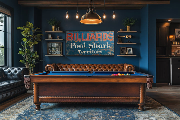 Vintage Billiards Sign with Pool Shark Territory text on a blue wall above a pool table.