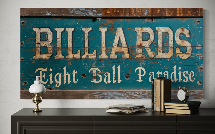 Vintage Billiards Eight Ball Paradise sign on a teal wood background above a dark console table.
