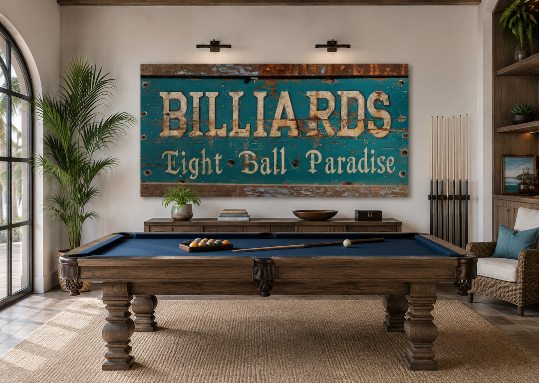 Vintage Billiards Eight Ball Paradise sign on a wall above a wooden pool table in a game room.