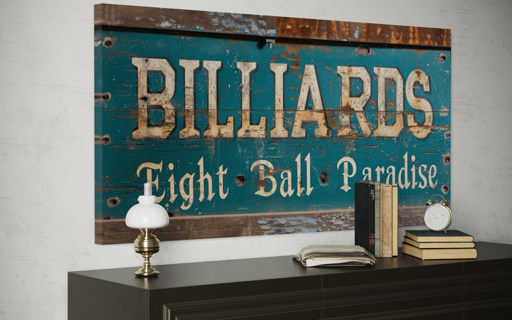 Vintage billiards sign wall art with 'Eight Ball Paradise' text on a distressed teal wood background.