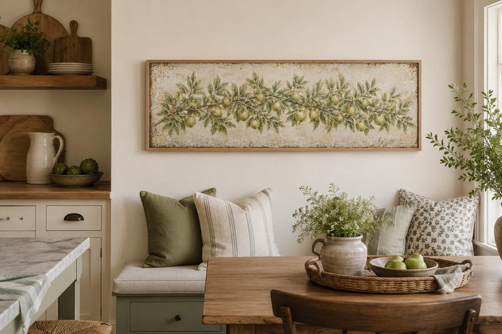 Long narrow vintage botanical canvas painting of a green apple branch in a farmhouse kitchen.