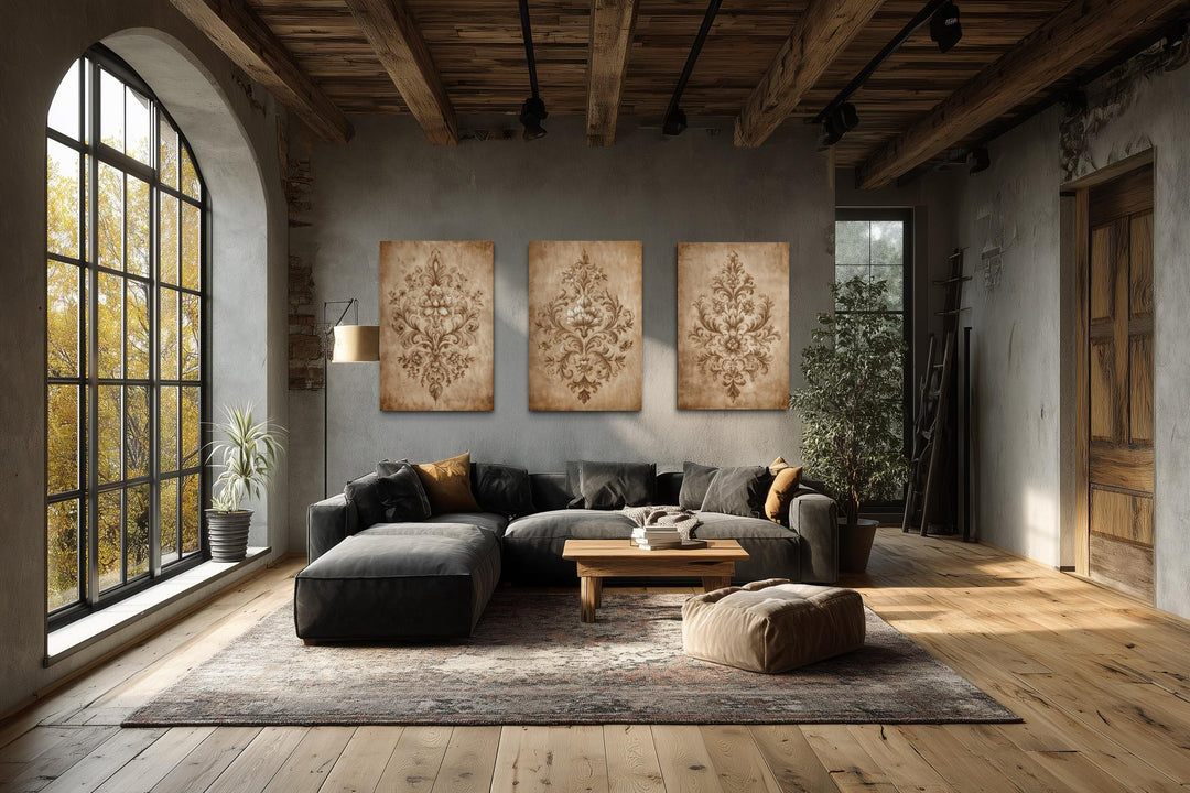Three vertical canvas prints featuring intricate beige damask patterns on a neutral background.