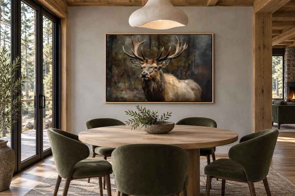 Vintage deer in the forest framed canvas wall art hanging above a round wooden dining table.