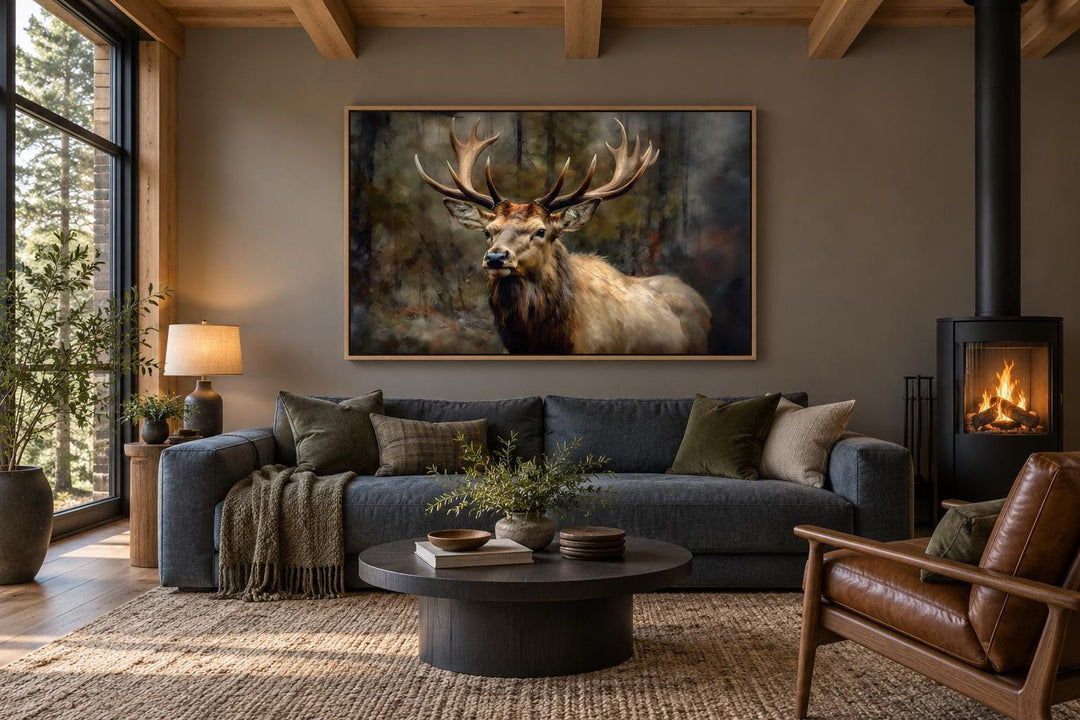 Vintage deer in the forest framed canvas wall art hanging above a sofa in a rustic living room.