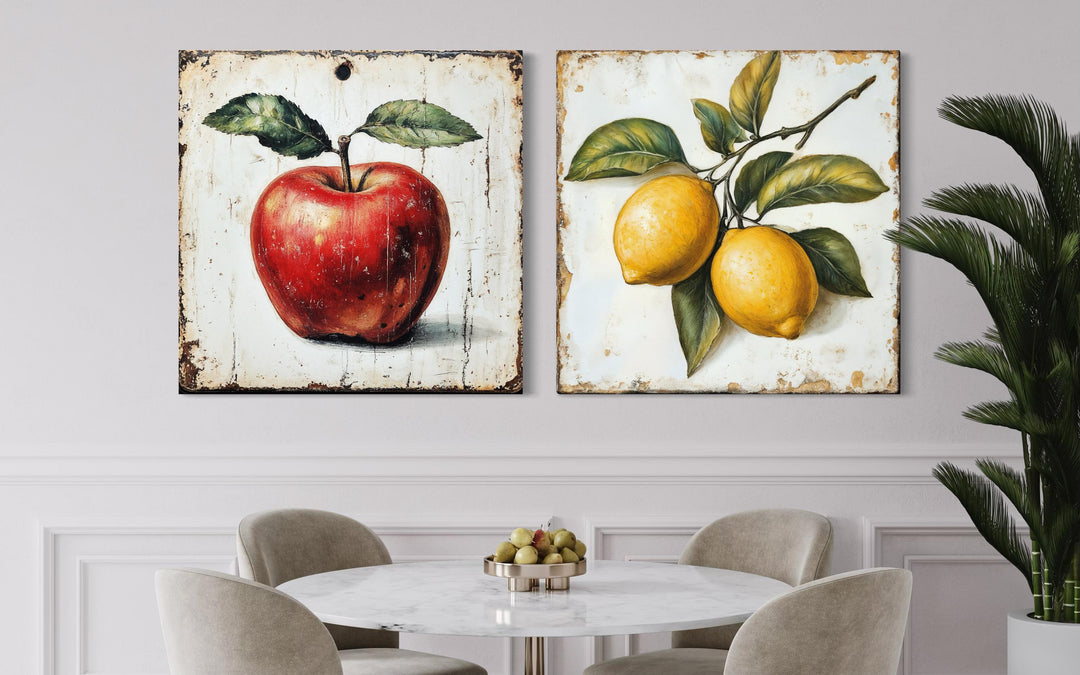 Set of two vintage-style square canvas prints featuring a red apple and yellow lemons.