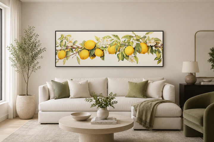 Vintage lemon tree panoramic framed canvas wall art hanging above a white sofa in a living room.