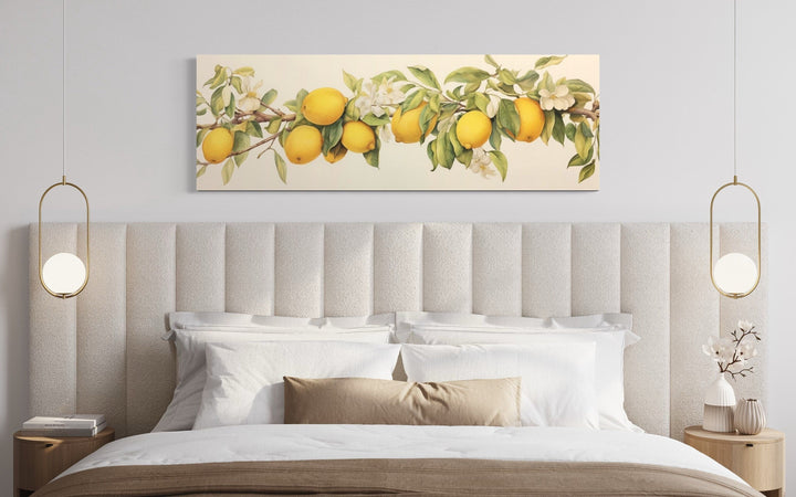 Vintage lemon tree panoramic framed canvas wall art hanging above a bed with neutral bedding.