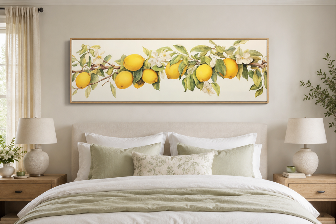Vintage lemon tree panoramic framed canvas wall art hanging above a bed with green and white linens.