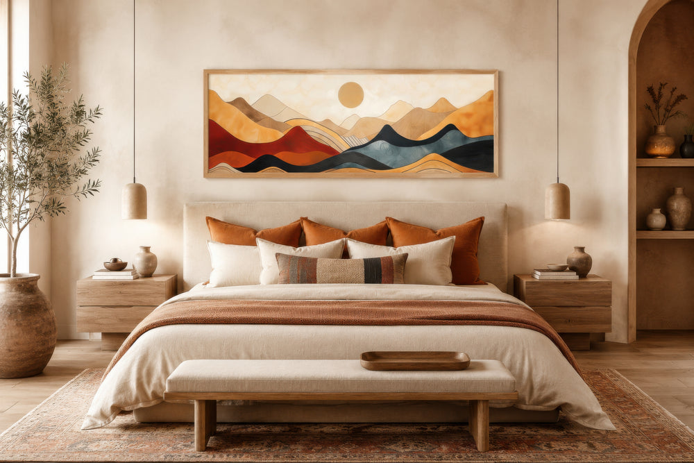 Vintage mid-century modern long horizontal mountain canvas wall art above a bed in a neutral room.