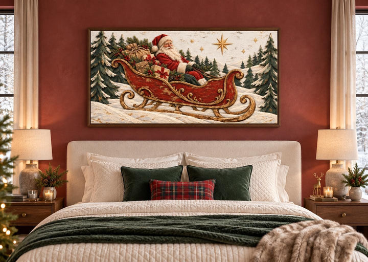 Vintage Santa Claus in a red sleigh framed canvas wall art above a bed with festive decor.