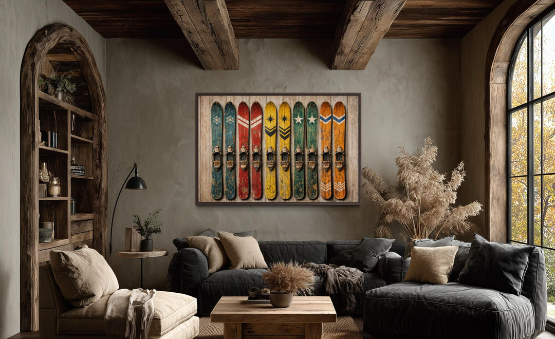 Vintage ski wall art featuring colorful retro skis on a rustic wooden background in a cozy room.