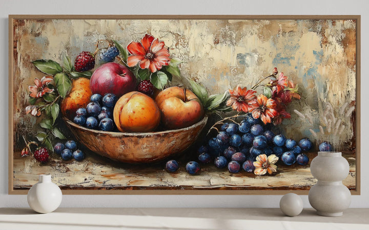 Vintage still life fruit bowl framed canvas wall art above a shelf with decorative vases.