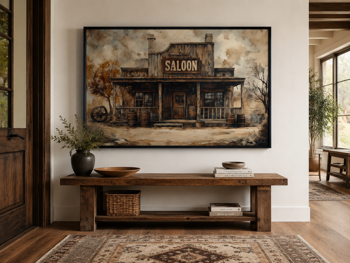 Vintage Western Saloon framed canvas wall art hanging above a rustic wooden bench in a home.