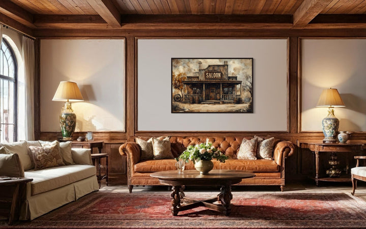 Vintage Western Saloon framed canvas wall art hanging above a leather sofa in a rustic living room.