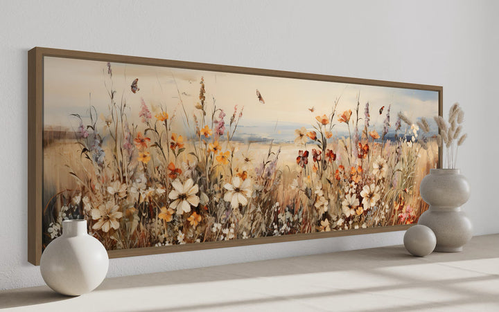 Vintage wildflowers field canvas wall art in a long horizontal frame with soft earthy tones.
