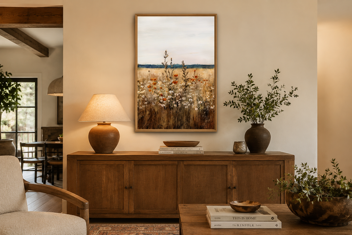 Vertical framed canvas wall art featuring a vintage painting of a wildflower field in earthy tones.